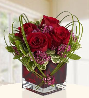 4 Stem of Red Roses in a Cube Vase with greens ( Steel Grass ) Cupids Bow