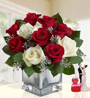 BUNCH 7 Red and 5 white roses with greens and gyspophillia Truly Magic