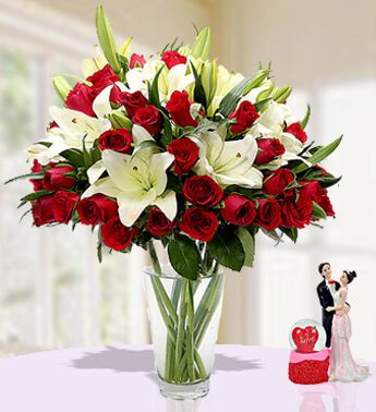 5 stems of White Lilies and 20 Red Roses with fillers in a vase Memorable Moments