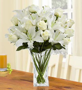 12 White Roses and 5 stems of White Lilies in a Vase Essence of Grace