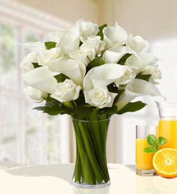 12 stems of White Roses and 10 stems of Calla Lilies in a Vase Divinely Gift
