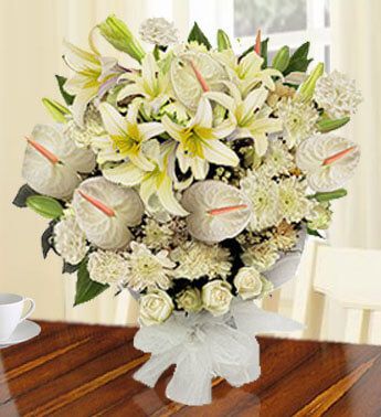 Bunch of 5 stems of White Lilies, 5 stems of White Anthuriums , 10 White Carnations , 10 White Roses & 2 stems of White Chrysanthemums Moon Light
