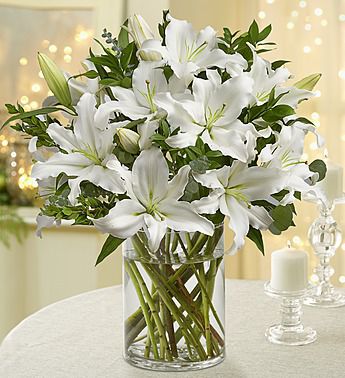 10 stems of White Lilies (Approx 30 Flowers) in a vase. Eternal Light 30