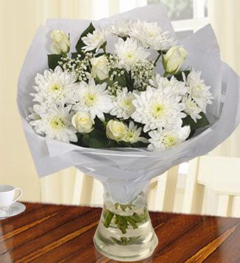4 stems of White Chrysanthemums, 6 White Roses in a Glass vase. Pure White Bouquet