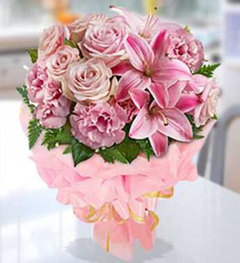 Bunch of 6 Stems Of Pink Roses 6 Stems Of Pink Carnations & 3 Stems of Pink Lilies (Approx 9 Flowers) in Nice wrapping Pink Perfection