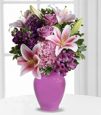 2 stems of Purple Alstromeria, 1 Pink Hydrangea, 2 stems of Pink Lily, 5 Purple Rose in a Purple Glass Vase (One side round arrangement) Luxurious Treat