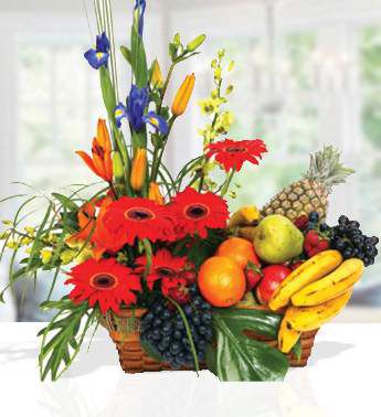 Arrangement of Mixed seasonal fruits and seasonal flowers comes in a beautiful basket.It's also a beautiful visual arrangement, just right for this merry season! Fruits and Flower Basket