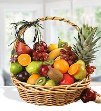 Willow Basket with sweet pineapple, oranges, apples, pears, grapes and kiwis . Supreme Fruits Basket